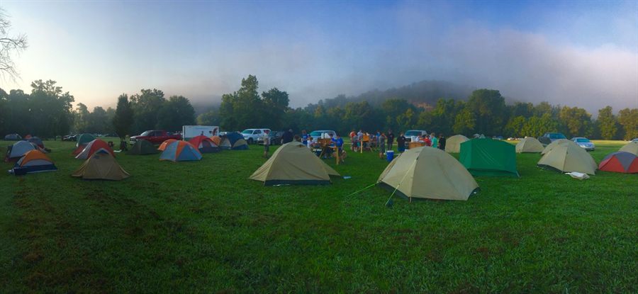 Tents across a grassy campground