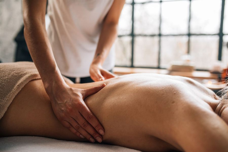 Massage in a bright spa room